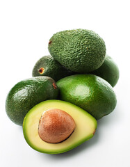 avocado whole and sliced scattered around background concept isolated white