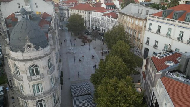 Aerial drone view of people at Largo do Intendente in Lisbon, Portugal