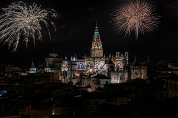 Scenic view of Toledo Cathedral at night with vibrant fireworks