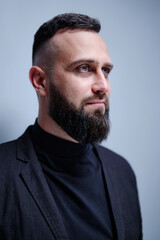 Obraz premium Studio portrait of young handsome man with beard.