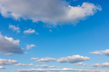 white clouds against the blue sky