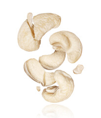 Group of tasty whole and cracked cashew nuts in the air close-up, isolated on a white background