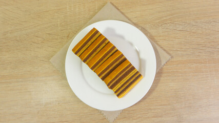 Lapis Legit Spekoek or Indonesian Layer Cake Served on White Plate, indonesia signature cake.