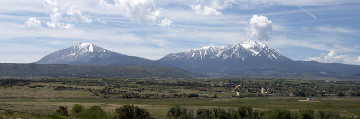 Ultra-wide panorama of Colorado's freestanding Spanish Peaks in May