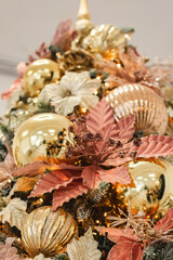 a Christmas tree in soft pink and gold tones. interior decoration at home and in the office
