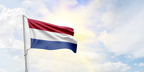 Netherlands flag waving on sky background. 3D Rendering