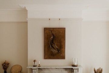 Abstract Artwork Above a Marble Fireplace in Minimalist Interior