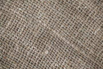 Close up background, natural craft brown linen fabric, thread weave, textile texture, perfect for backgrounds, textiles, wallpapers