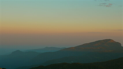 Beautiful mountain landscape during sunset with vibrant sky colors, showcasing serene nature and tranquility. Outdoor Adventures and Natural Beauty.