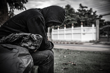 Asian man is homeless at the side road,A stranger has to live on the road alone because he has no...