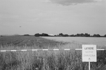 airport in Panensky Tynec in Czechia on 8. July 2024 on black and white film - blurriness and noise of scanned 35mm film were intentionally left in image