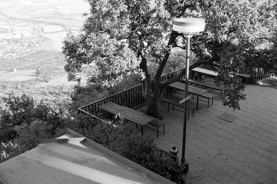 terrace of KCT cottage on Lovos in Czechia on 29. July 2024 on black and white film - blurriness and noise of scanned 35mm film were intentionally left in image