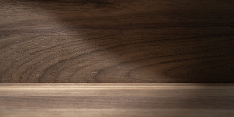 Natural dark wood texture with subtle shadows and grain patterns. This minimalist, rustic background is ideal for product displays, creating an elegant and organic presentation.

