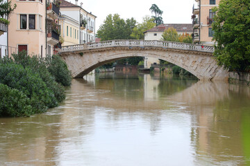 Fototapeta premium Ancient Bridge called PONTE SAN MICHEL in Vicenza City in Northern ITALY during the flood and the RETRONE river