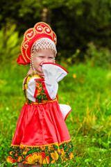 Little cute girl in folk costume