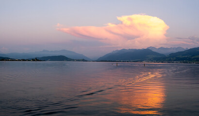 Fototapeta premium Sunset view of the Upper Zurich Lake from the historical Holzbrücke, St. Gallen, Switzerland