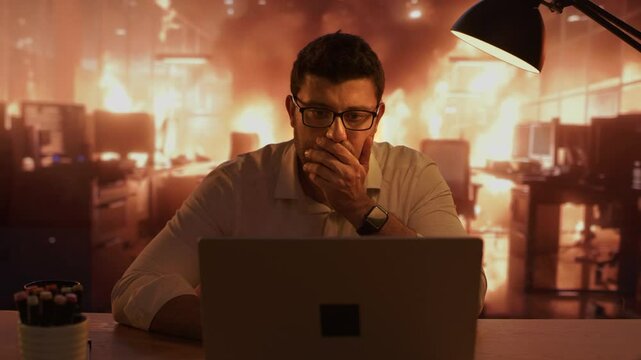 Stressed Man Drinking Coffee at Desk Under Pressure as Office Burns Flames Chaos Workload