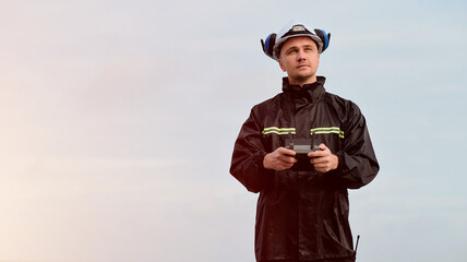 Offshore Worker In Safety Clothes Holding Drone Remote Transmission Control Device