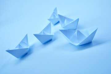 paper boats on the paper background