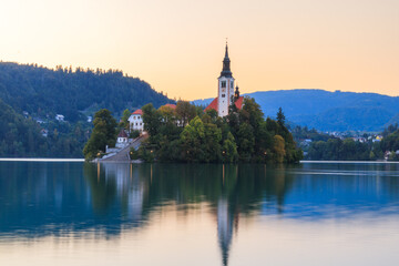 Lake bled in the slovenian alps slovenia during sunset with warm golden light golden hour