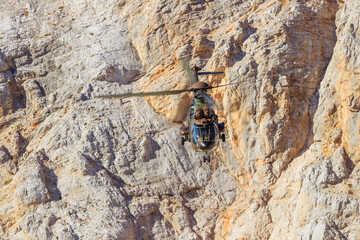 Slovenian military helicopter flying in the slovenian alps julian alps