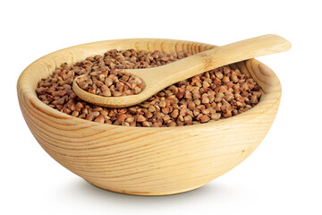 Raw buckwheat in wooden bowl isolated on white background