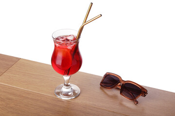Glass of tasty refreshing drink, straws and sunglasses on wooden table against white background