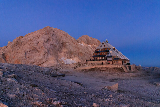 Mountain Triglav during blue hour in the Slovenian Alps Julian Alps with triglav mountain hut in foregroung