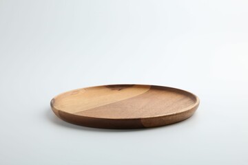 One wooden plate on white background. Tableware