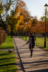 Woman walking in the park with dog