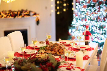 Christmas dinner at fire place and Xmas tree.