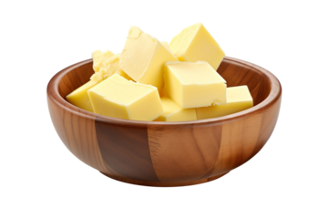 pieces of butter in a brown bowl isolated on transparent background