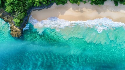 Aerial view of a stunning Mediterranean beach. The blue sea glistens under the sun, waves gently breaking on the shore. A serene and beautiful scene