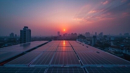 Fototapeta premium Men technicians working on a factory roof installing photovoltaic modules in morning light