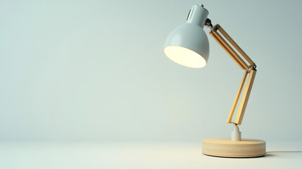 Modern Wooden Desk Lamp with White Shade and Light on Against a Light Blue Background