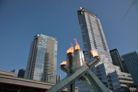 The 2010 Olympic Cauldron burning celebrating 2011 Canada day at Vancouver coal harbour in downtown Vancouver, British Columbia, Canada.