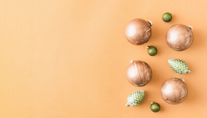 Christmas frame with balls on a colored background