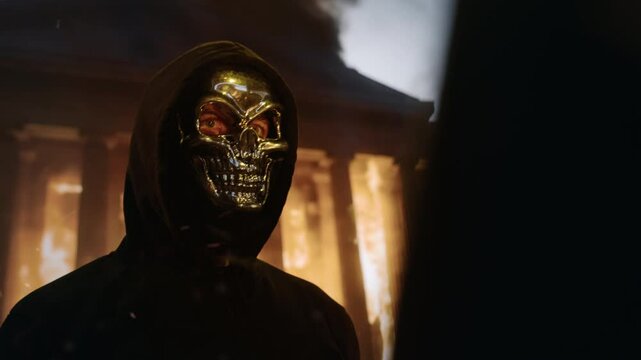 Mysterious Metallic Skull Mask Man Against Burning Building Dark Horror Cinematic Scene