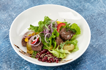 fresh salad with beef and sauce