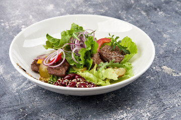 fresh salad with beef and sauce