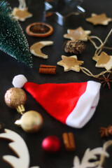 Various Christmas decorations in neutral colors on dark background. Selective focus.