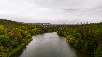 Vilnia River in Vilnius, Lithuania. Top cinematic aerial view. Beautiful nature. Famous city park in Vilnius