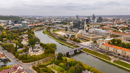 Obraz premium Beautiful Aerial view of the old town of Vilnius, the capital of Lithuania. Top cinematic aerial view. Vilnius cityscape in a beautiful autumn day, Lithuania. 