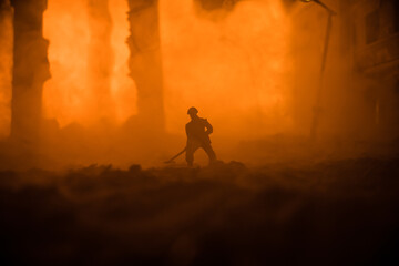 War Concept. Military silhouettes fighting scene on war fog sky background. Sappers clears mines at...