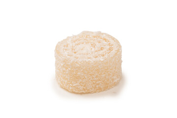 Coconut candy roll isolated on a white background.