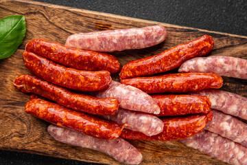 raw sausages beef, pork, chicken, lamb, dish fresh delicious gourmet food background on the table rustic food top view copy space