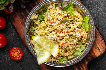 tabbouleh couscous bulgur vegetable dish fresh vegetarian vegan food gourmet food background on the table rustic food top view copy space keto and paleo diet