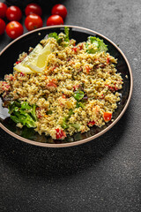 tabbouleh couscous bulgur vegetable dish fresh vegetarian vegan food gourmet food background on the table rustic food top view copy space keto and paleo diet