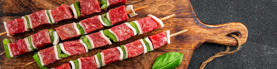 meat kebab raw vegetable, beef, lard, pepper dish fresh gourmet food background on the table rustic food top view copy space