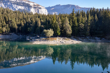 Beautiful and peaceful Lake Cauma in the swiss alps in summer.